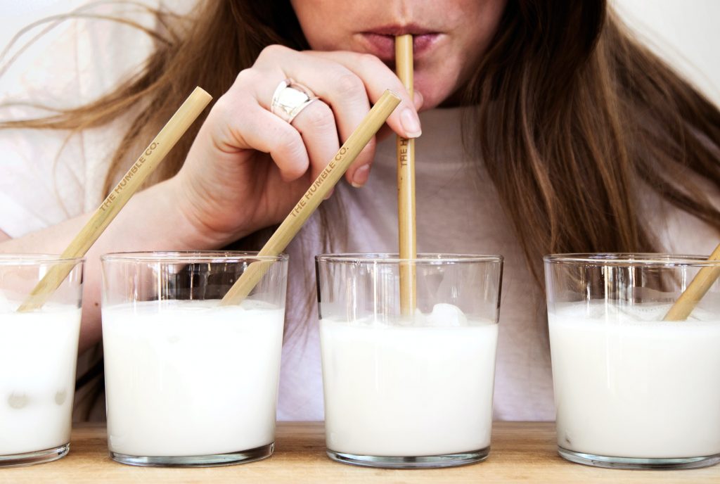 Woman drinking milks out a straw