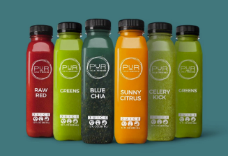 Variety of colorful PUR Cold Pressed Juices made from fresh fruits and vegetables, representing a delicious and convenient way to fuel a healthy lifestyle